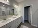 Bathroom featuring double sinks, stone tile floors, and plenty of counter space at 131 Brown Swiss Cir, Summerville, SC 29483