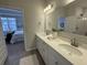 Bright bathroom featuring double sinks and a view into the bedroom at 131 Brown Swiss Cir, Summerville, SC 29483