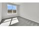 Light-filled bedroom features a large window with views of the community under construction at 131 Brown Swiss Cir, Summerville, SC 29483