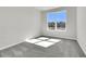 Sunlit bedroom featuring a large window with views of the community under construction at 131 Brown Swiss Cir, Summerville, SC 29483
