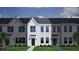 Exterior of the new white townhome with black door, windows, and a green lawn at 131 Brown Swiss Cir, Summerville, SC 29483