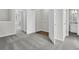 Open hallway with laundry closet and bathroom in an inviting new home at 131 Brown Swiss Cir, Summerville, SC 29483