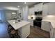 Modern kitchen with white cabinetry, stainless steel appliances, and a large island with barstool seating at 131 Brown Swiss Cir, Summerville, SC 29483