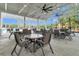 Covered poolside patio features ample seating and ceiling fans for outdoor gatherings and relaxation at 131 Brown Swiss Cir, Summerville, SC 29483