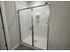 Modern bathroom shower featuring white subway tile and a sleek glass door at 131 Brown Swiss Cir, Summerville, SC 29483