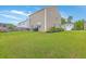 View of the private backyard with lush green grass, perfect for outdoor activities at 134 Stoney Creek Way, Moncks Corner, SC 29461