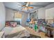 The bedroom has a gray ceiling fan, a wall decor, a monitor and wall writing at 134 Stoney Creek Way, Moncks Corner, SC 29461