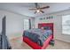 This charming bedroom features a ceiling fan and a large window with natural light at 134 Stoney Creek Way, Moncks Corner, SC 29461