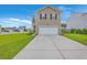 Charming two-story home with a large driveway and attached garage at 134 Stoney Creek Way, Moncks Corner, SC 29461