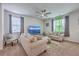 Cozy living room with ample seating, ceiling fan, and lots of natural light at 134 Stoney Creek Way, Moncks Corner, SC 29461