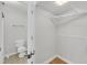 This bathroom features a toilet and a wire rack shelf for storage at 1402 Camp Rd # 8B, Charleston, SC 29412