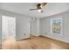 Sunlit bedroom features a view of the neighborhood and an entry way to a bath at 1402 Camp Rd # 8B, Charleston, SC 29412