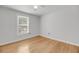 Bedroom with hardwood floors features a view of the neighborhood at 1402 Camp Rd # 8B, Charleston, SC 29412