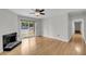 Bright living room with hardwood floors, fireplace, and sliding glass doors to a patio at 1402 Camp Rd # 8B, Charleston, SC 29412