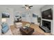 Stylishly decorated living room with a fireplace, dining area, and modern furnishings at 1402 Camp Rd # 8B, Charleston, SC 29412