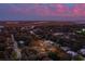 Stunning twilight aerial view of a charming neighborhood near the coast, under a sky painted with beautiful pink clouds at 1454 Seminole St, Mount Pleasant, SC 29464