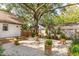 Backyard featuring a large shade tree, patio, and fire pit area at 1454 Seminole St, Mount Pleasant, SC 29464