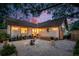 Backyard with stone landscaping, patio, and fire pit area with room to entertain at 1454 Seminole St, Mount Pleasant, SC 29464