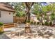 Backyard featuring a large shade tree, patio, and fire pit area at 1454 Seminole St, Mount Pleasant, SC 29464