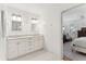Bright bathroom features double vanity and mirrors, with hexagon tile flooring, and an open view to a bedroom at 1454 Seminole St, Mount Pleasant, SC 29464