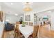 Open concept dining room with hardwood floors and stylish light fixture at 1454 Seminole St, Mount Pleasant, SC 29464