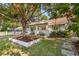 Home featuring mature trees, landscaped yard and inviting front porch at 1454 Seminole St, Mount Pleasant, SC 29464