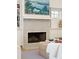 Close up of fireplace with decorative surround, built in shelving, and stylish mantle decor at 1454 Seminole St, Mount Pleasant, SC 29464