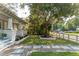 Charming home featuring a well-maintained lawn with a beautiful tree and tasteful landscaping at 1454 Seminole St, Mount Pleasant, SC 29464