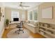 A home office featuring a desk, a built-in window seat and a modern bookcase at 1454 Seminole St, Mount Pleasant, SC 29464