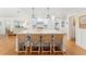 Spacious kitchen island with white marble countertops and modern pendant lighting at 1454 Seminole St, Mount Pleasant, SC 29464