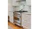 Gourmet kitchen featuring a stainless steel range, subway tile backsplash, and custom cabinetry at 1454 Seminole St, Mount Pleasant, SC 29464