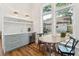 Charming kitchenette with table and chairs, complemented by lots of natural light and scenic backyard views at 1454 Seminole St, Mount Pleasant, SC 29464