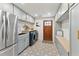 Well-equipped laundry room featuring modern appliances, ample storage, and stylish tile flooring at 1454 Seminole St, Mount Pleasant, SC 29464
