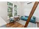 Cozy living area with large window, seating, table, and an access ladder to the loft, creating a comfortable space at 1454 Seminole St, Mount Pleasant, SC 29464
