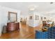 Open-concept living space with views of the kitchen and dining area and a hardwood floor throughout the main level at 1454 Seminole St, Mount Pleasant, SC 29464