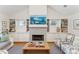 Cozy living room with vaulted ceilings, custom built-ins, and a stylish fireplace, offering a comfortable retreat at 1454 Seminole St, Mount Pleasant, SC 29464