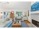 Inviting living room featuring fireplace, comfortable seating, hardwood floors, and stylish decor at 1454 Seminole St, Mount Pleasant, SC 29464