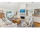 Comfortable living room features a fireplace, built-in shelving, and stylish seating for a cozy and inviting atmosphere at 1454 Seminole St, Mount Pleasant, SC 29464