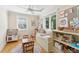 Spacious playroom with windows, wooden floors, and plenty of storage and toy areas at 1454 Seminole St, Mount Pleasant, SC 29464