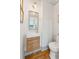 Chic powder room featuring elegant wallpaper, a modern vanity, and stylish fixtures at 1454 Seminole St, Mount Pleasant, SC 29464