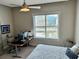 Cozy bedroom with a bed, a large window, and views of the cityscape at 150 Bee St # 611, Charleston, SC 29401