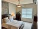 Bedroom with a bed, ceiling fan, dresser, and a window for natural light at 150 Bee St # 611, Charleston, SC 29401