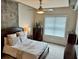Bedroom featuring a bed, large window, and a dresser at 150 Bee St # 611, Charleston, SC 29401