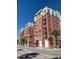 Stunning multi-story building with brick facade, private balconies and lush palm trees at 150 Bee St # 611, Charleston, SC 29401