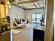 Inviting living room featuring a plush sofa, floor-to-ceiling sliding doors, and concrete ceiling at 150 Bee St # 611, Charleston, SC 29401
