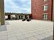 Outdoor patio space with a brick building and seating area at 150 Bee St # 611, Charleston, SC 29401