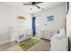 bedroom featuring neutral tones, white furnishings, and a comfortable crib at 1513 Thin Pine Dr, Johns Island, SC 29455