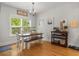 Bright dining area features a wood table, bench seating, and pendant lighting for intimate meals at 1513 Thin Pine Dr, Johns Island, SC 29455