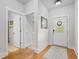 Bright entryway features hardwood floors, white walls, and a front door with a decorative window at 1513 Thin Pine Dr, Johns Island, SC 29455