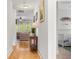 Long hallway with hardwood floors connects the living spaces and bedrooms of the home at 1513 Thin Pine Dr, Johns Island, SC 29455